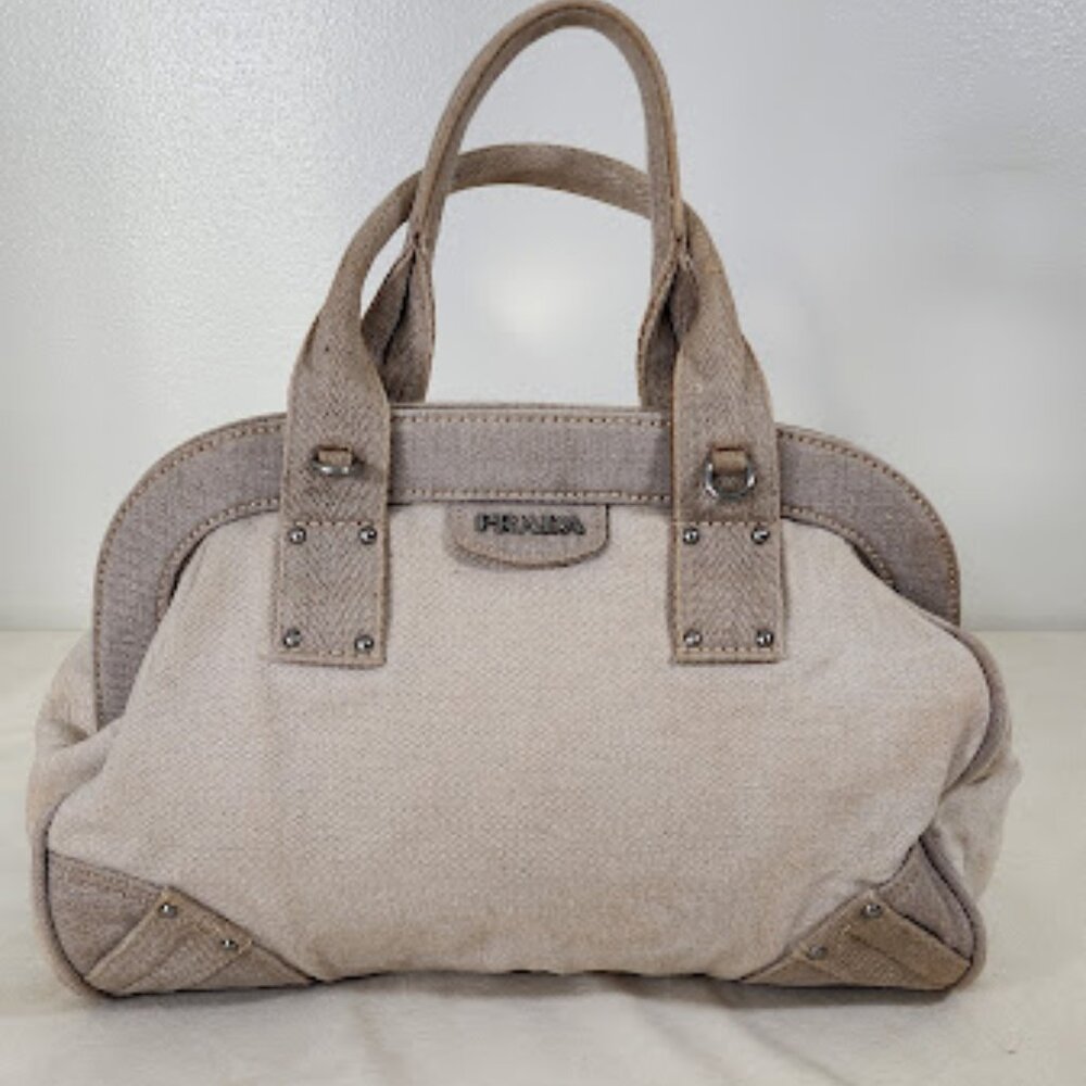 Prada Canvas Bowler Bag. Light Discolor on sides where bag folds.